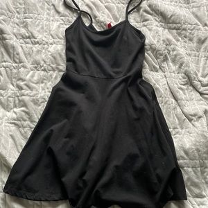 Divided little black mini dress, cotton material. Fits size XS.